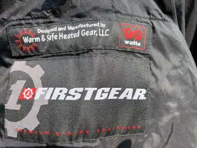 This is a First Gear heated motorcycle jacket liner in size large, offering warmth and comfort durin...