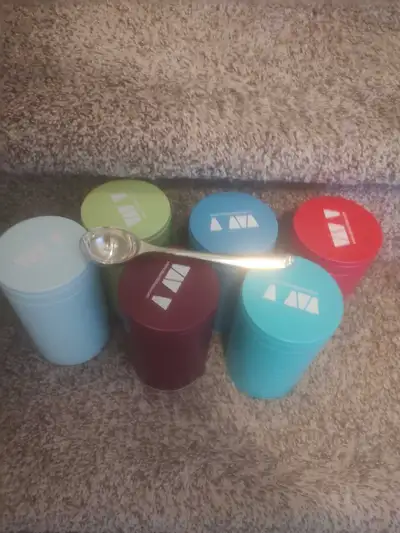 6 David's tea cans and 1 silver spoon , View more