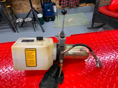12 volt, 1500lb hydraulic pump with metered flow valve. Came off of a forklift/pallet jack. Many use...