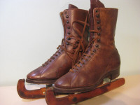 Vintage ice figure skates with leather guards