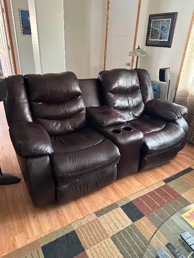 Genuine leather reclining love seat. Very nice and soft.