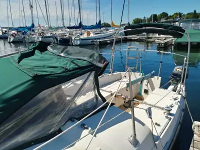 Ready to sail...comes with trailer and four stoke Yamaha 9.9 long shaft.Trailer has new bearings and...