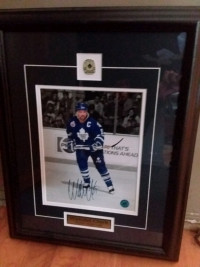 Toronto Maple Leaf Wendel Clark Autographed picture holdng stick