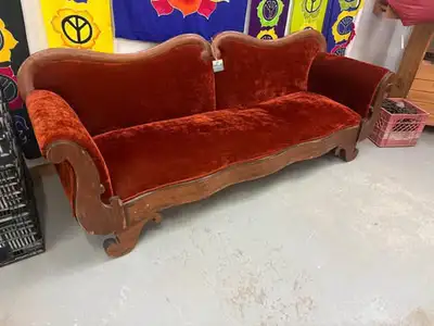 Victorian-style antique sofa, likely from the mid-to-late 1800s or an early 1900s reproduction•Carve...