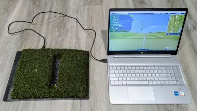 Rarely used Optishot simulator + 5'x3' mat + extra thick replacement turf, all for $350 OBO. App com...