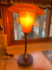 Vintage spun lucite lamp. Measures 27” tall.
