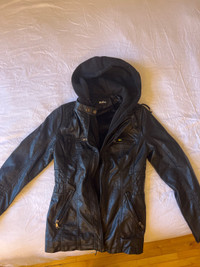 Woman’s f-leather jacket with hoodie used for modeling 