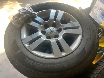 4 - 18” 6-bolt factory alloy wheels with tires (about 3/16” tread left) and lug nuts. For Toyota tac...