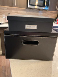 Selling 2 storage boxes, one cardboard other is  faux leather