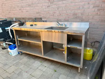 Stainless steel restaurant counter with sink. See pics for measurements. Text 4169493411. $700 obo
