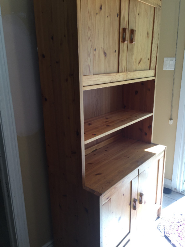 Wood / bookcase upper and lower portions have doors