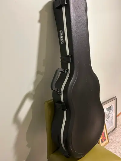 Hard shell SKB travel guitar case, View more