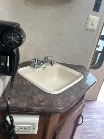 2014 travel trailer is 27 feet The trailer features a cozy living area with comfortable seating, a f...