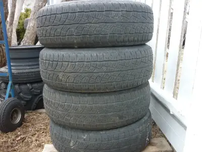 4 17IN. BRIDGESTONE WINTER TIRES P235/65R17 ON 5 LUG RIMS OFF SANTA FE - $120.00