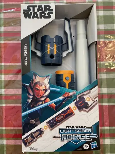 For sale is a brand new unopened Star Wars lightsaber - Ashoka tano. The item comes from a smoke and...