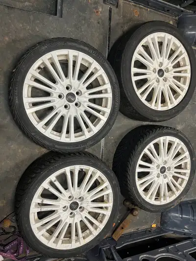 18” Ford rims off a ford focus. 5x108 bolt pattern, they will fit other ford cars. Tires have a litt...
