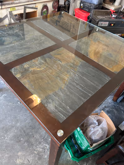 Counter height table with 8 chairs. Slate tile inlay with glass. Very heavy. Minor damage from a pup...