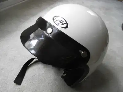 White open face motorcycle helmet with sun shield. Never dropped, no marks or damage and used only a...