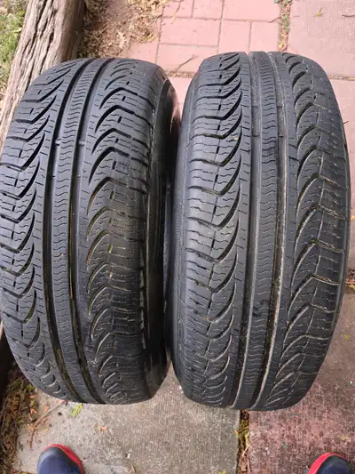 2 FOUR SEASONS TIRES PIRELLI - P- 4 94 T M+S. $ 60 FOR BOTH. Pick up in Wasaga Beach.