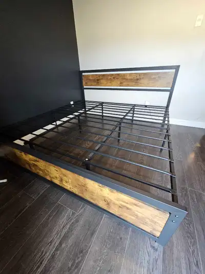 King size Steel/wood bed frame and night stand, comes from a pet free and smoke free home. In great...