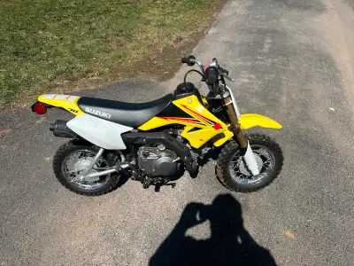 2016 DR-Z70 Suzuki. Training wheels Size Small helmet. In great condition. Great beginner dirt bike....