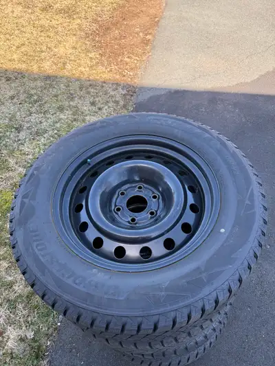 20” steel rims with blizzard tires. Tires are worn, but the rims are in good shape. For sale as is.