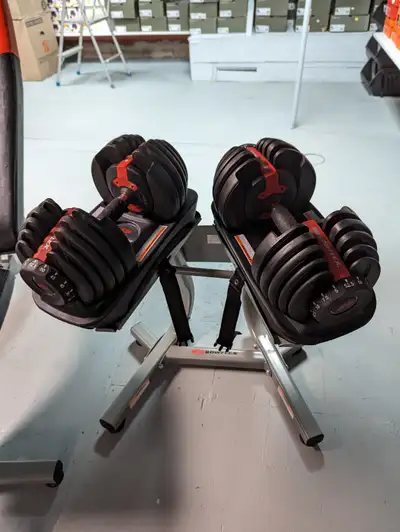 For sale is a Pair of Bowflex 552 Selecttech Adjustable Dumbbells ,goes up to 52.5lbs, also comes wi...
