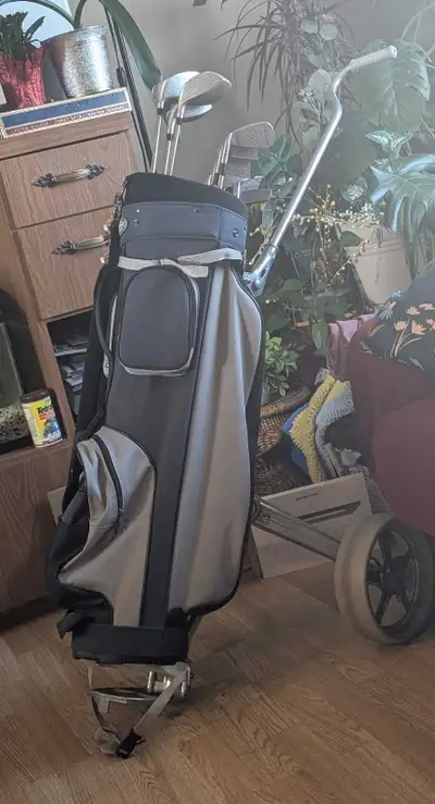 Men's golf cart and clubs., View more