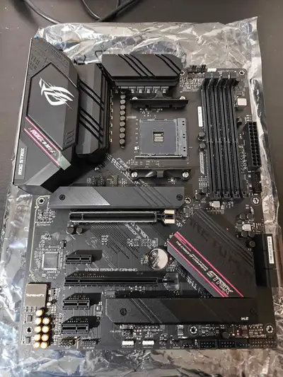 Basically new, used once to test it out, doesn't come with box, still has the stickers on the MOBO....