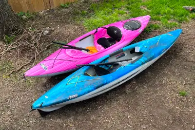 Two kayaks with paddles, View more