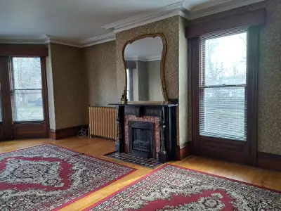 A large 1 bdrm flat + den/office on the 1st floor of a Registered Heritage House. Very large living...