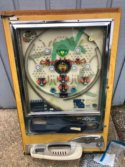 Vintage 1970’s Pachinko Machine made in Japan by NIshijin. This unit is set in a solid wood frame wi...