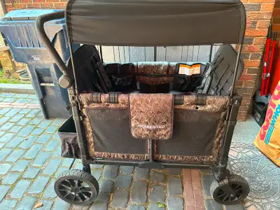 Wonderfold 4 seater stroller in camouflage. Retail price over $1000. Only used handful times and the...