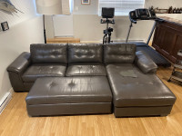 Faux leather sectional sofa with ottoman
