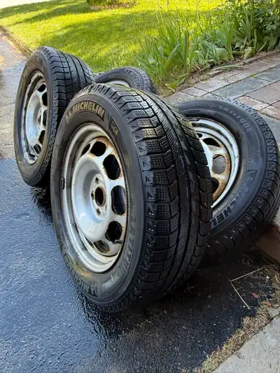 I'm offering a set of four Michelin Latitude X-Ice winter tires, size 225/60R17, mounted on steel ri...