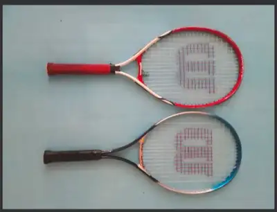 2 Junior tennis rackets 25"(raquettes de tennis pour jeunesse), solid and good shape, in good condit...