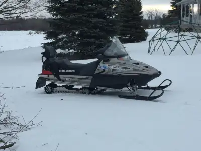 Selling my low mileage 2003 Polaris 500 Classic Touring snowmobile, perfect for comfortable two-pers...