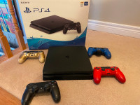 Sony PlayStation 4 Slim 1TB Console with Four (4) Controllers
