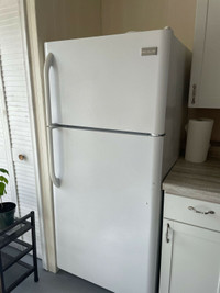Frigidaire white refrigerator,The height is 66 and width is 30.