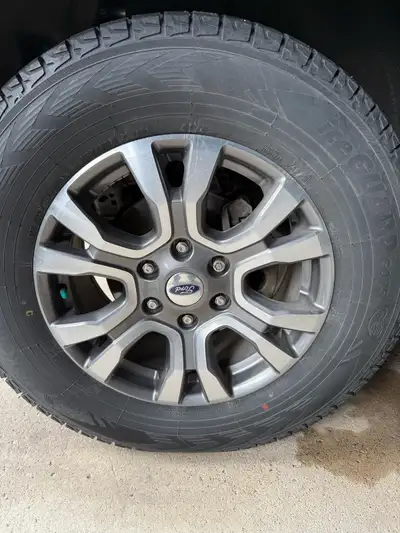 Selling a set of four Yokohama IceGuard tires, size 255 70 R18, mounted on Ford Bronco/Ranger OEM Wh...
