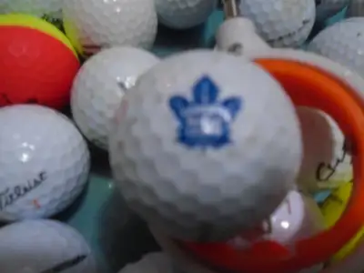 60 golf balls and one golf ball picker, View more