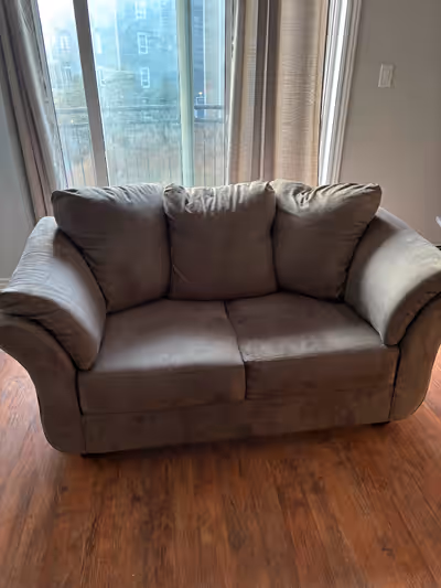 Couch has a few small tears on the corners love seat has none