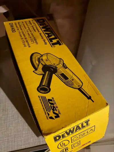 This brand-new DeWalt DW400 4-1/2 inch heavy-duty angle grinder is ready to tackle your toughest pro...