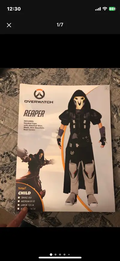 This is a pre-owned Spirit Halloween Reaper Costume in child size XL 14-16. It comes with everything...
