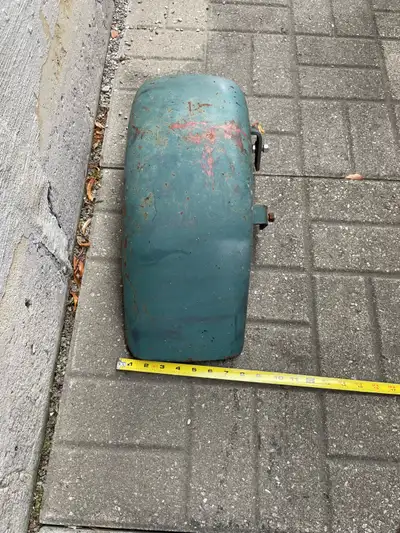 This is a vintage-style metal trailer fender that is in pre-owned condition with visible wear and su...