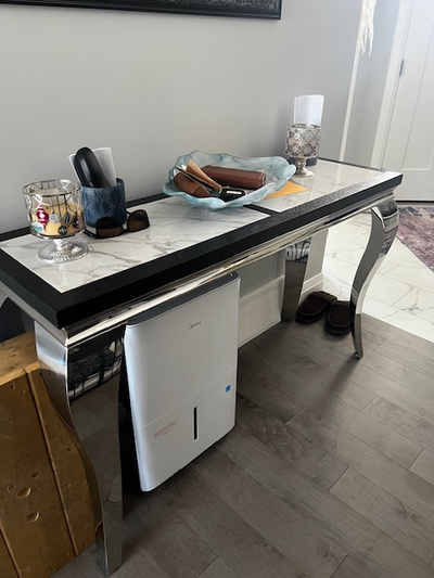 Chrome base with marble top. 52” long X 16” wide X 31 1/2” high