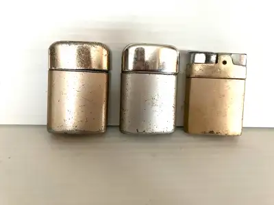Three vintage Ronson typhoon lighters wind proof British Empire made in Hong Kong. Show some wear.$1...