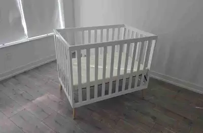 Used Delta mini crib with matress. L25.75" x W40" x H34.75"