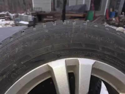 Set of four studded, 17 inch tires Came off an SUV Chevy Traverse