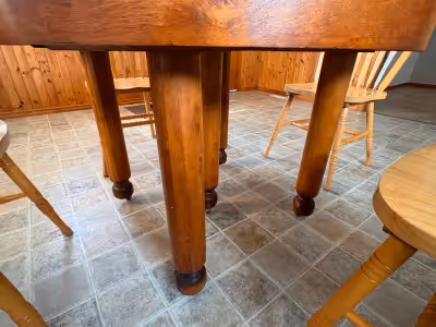 Antique Hardwood Round Table with 5 Legs and 4 Chairs. Table measures 42” round x 30” high.